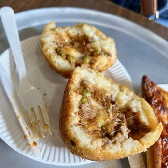 Arancini cut open showing filling
